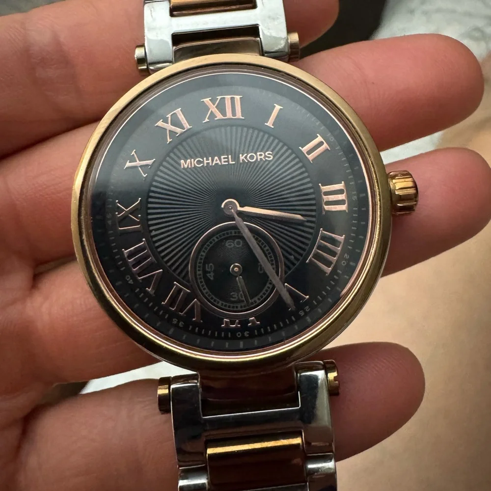 Michael Kors Rose Gold and Black Roman Numeral Wristwatch battery needed